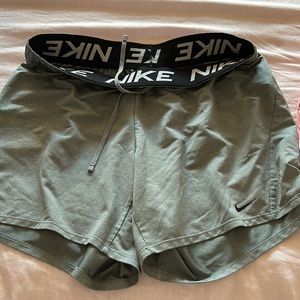 Nike Dri-fit shorts. Size medium. Charcoal grey with black waste band.
